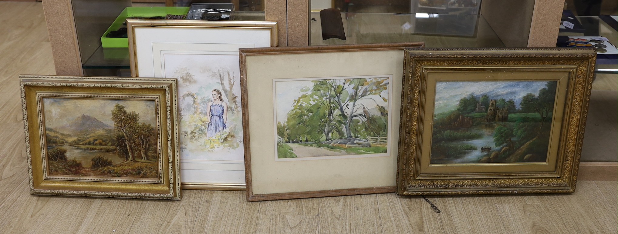 Victorian School, two oils; a mountainous landscape, a subject view of ruins amongst a river, together with two watercolours; a standing female in gaze, and a woodland walk. Largest 24 x 34cm